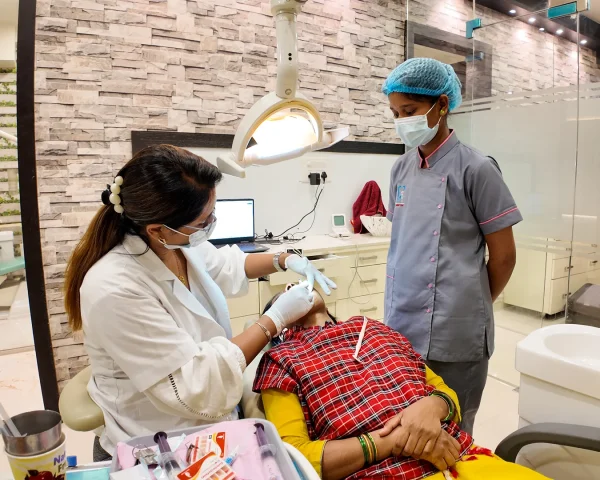 Friendly dental assistant preparing for a procedure